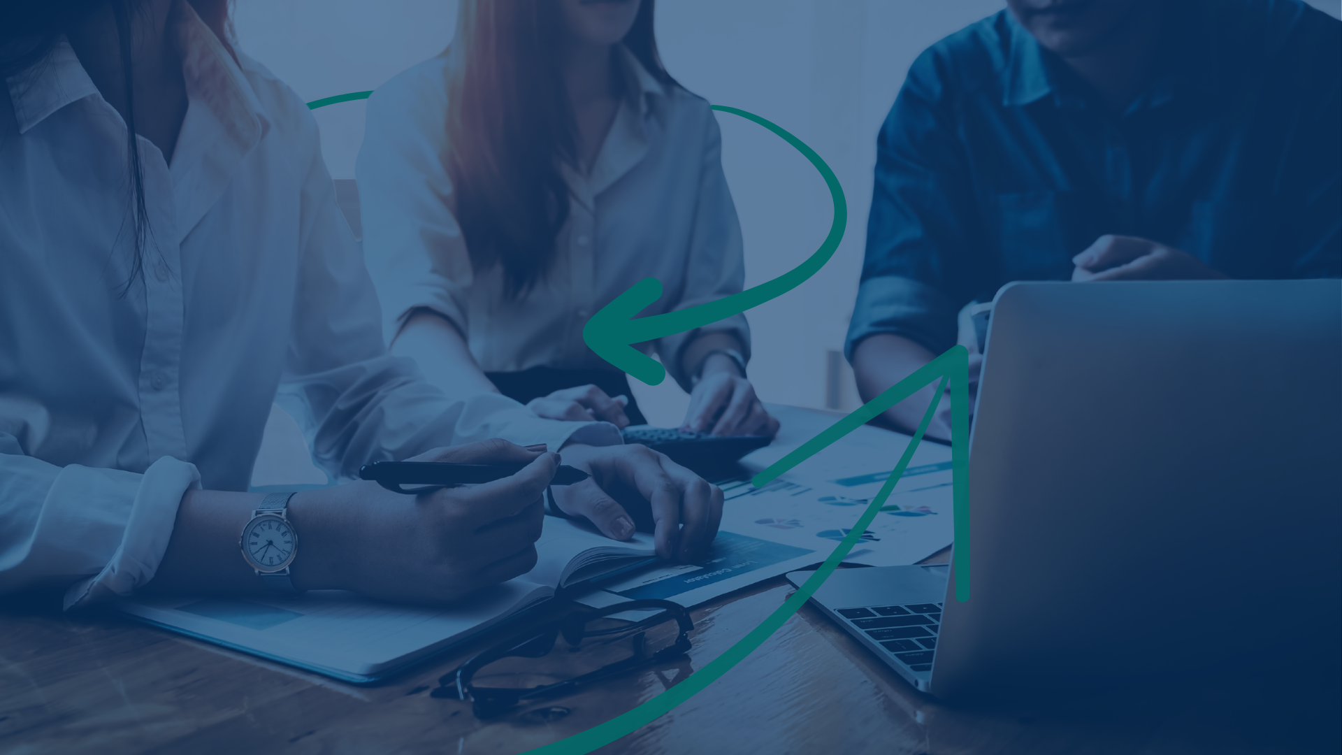 3 People at a table working on cross-sell strategies